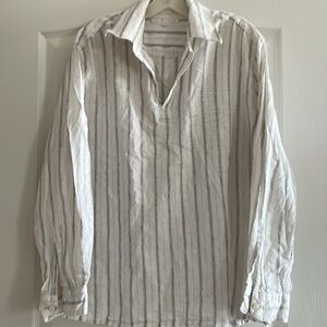 50% linen 50% cotton v neck shirt w long sleeves. Can be dress or casual.